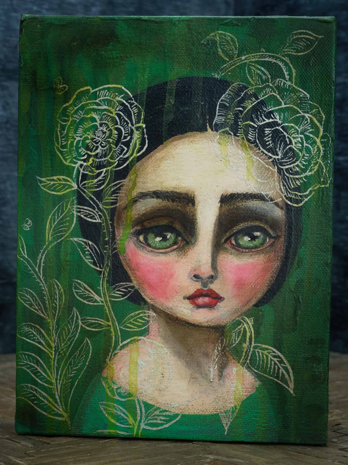 Peony is a beautiful girl with big green eyes painted by Danita in a surreal whimsical style