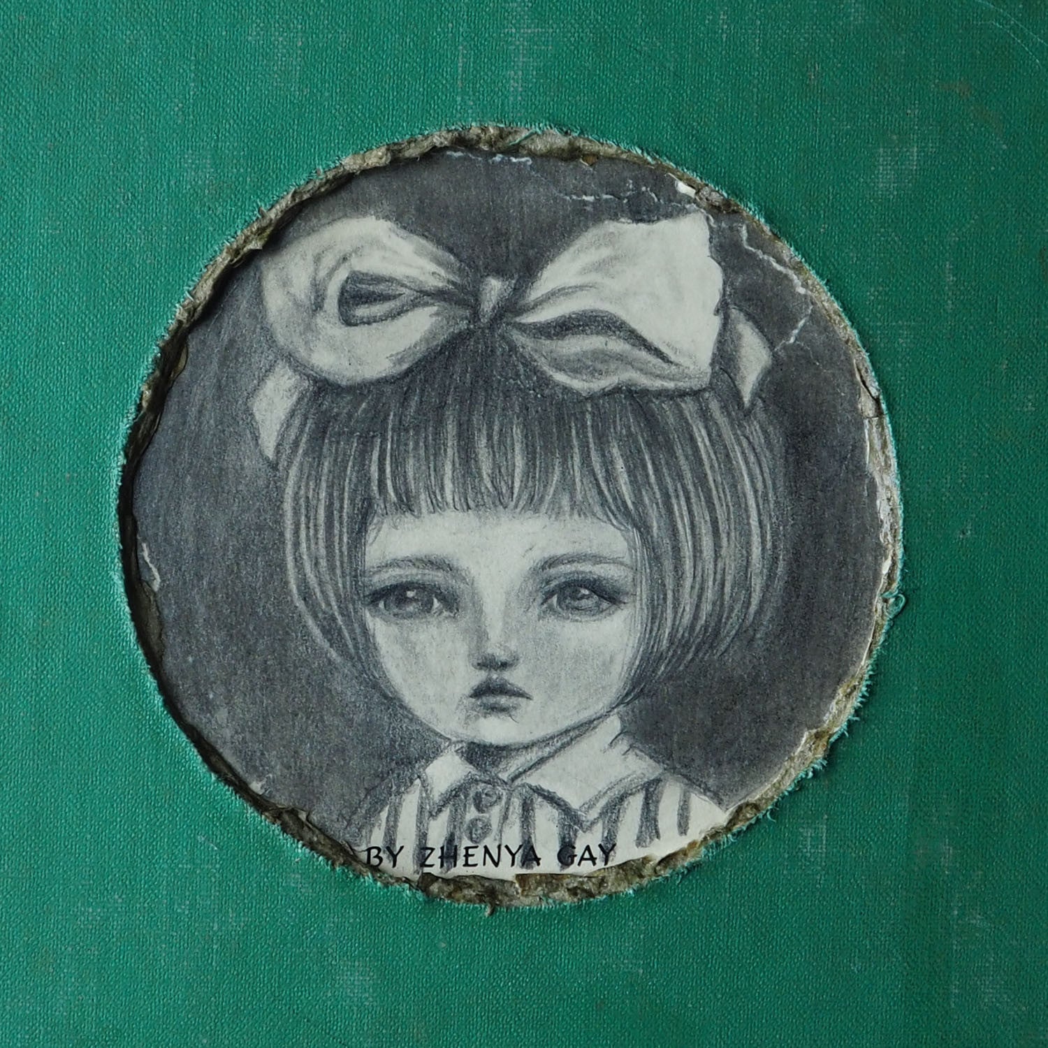 A beautiful mixed media altered book by Danita Art. One of her astonishing girls adorns the cover in a pencil and graphite drawing on the hard cover of an antique library book.
