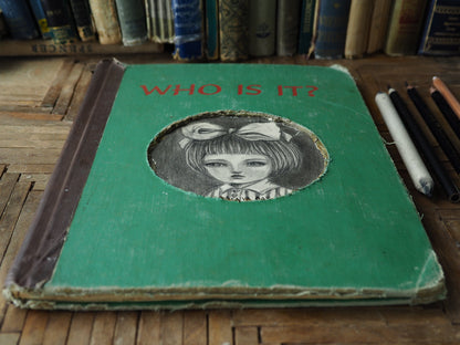 A beautiful mixed media altered book by Danita Art. One of her astonishing girls adorns the cover in a pencil and graphite drawing on the hard cover of an antique library book.