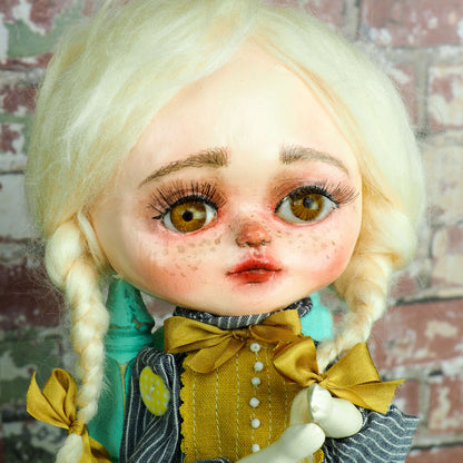 An original hand crafted art doll made by Danita. A blonde girl with a love for music, she plays her vintage vinyl records on her antique gramophone.