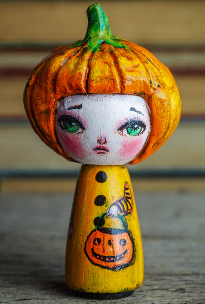 Danita original wooden kokeshi art doll. Home decor Halloween pumpkin jack-o-lantern girl mini figurine, perfect to decorate desks and shelves. Collectible items from Danita!