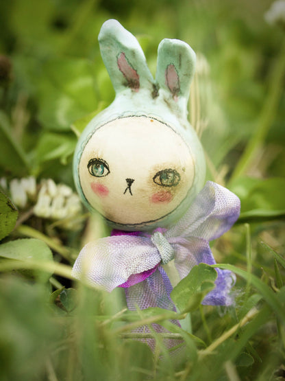 Adorable little handmade kokeshi Easter bunny rabbits are hopping along to Danita Art's studio, where she made them with wood and paper clay.