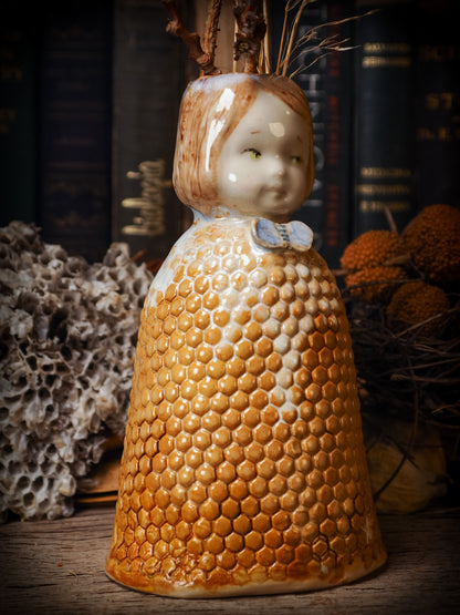Original handmade ceramic flower vase,  artist brush and pencil holder by Idania Salcido, Danita Art. A honeycomb bee shaped statue with china doll head. Handmade touch to any artist's studio with handmade glazed ceramic good for watercolors acrylics inks and oil paints. Clean with water or mineral spirits.