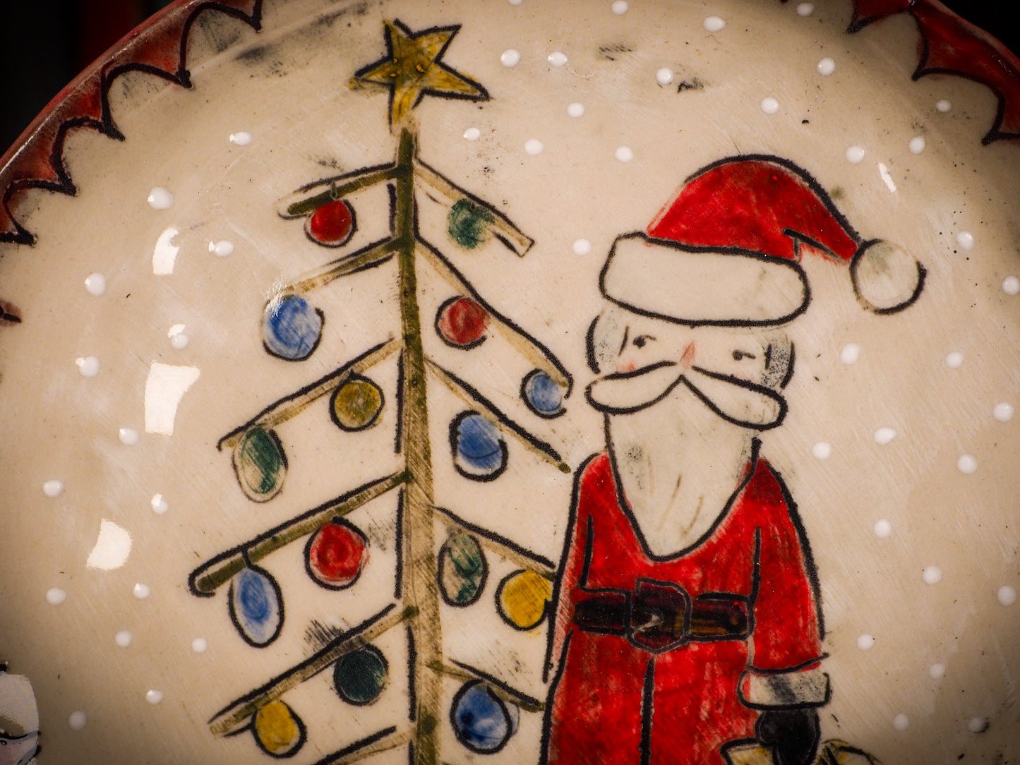 An original Christmas Holiday cake dinner plate round glazed ceramic dinnerware handmade by Idania Salcido, the artist behind Danita Art. Glazed carved sgraffito stoneware, hand painted and decorated, it is illustrated by hand with snowmen, Christmas trees, Santa Claus, angels and snow balls and winter themes.
