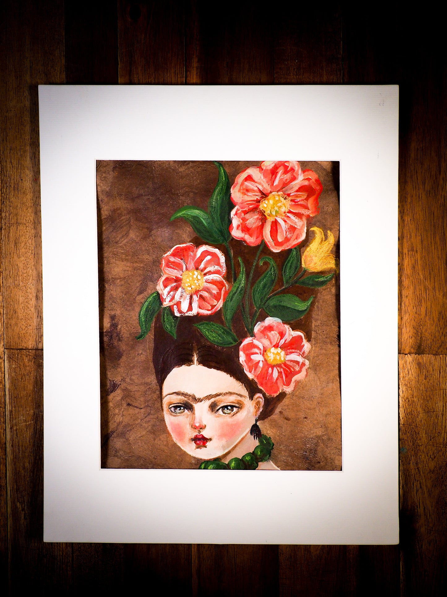 An original watercolor painting by Idania Salcido, the artist behind Danita Art.  This is a beautiful mixed media painting, Frida Khalo wearing a high hairdo with beautiful hand painted red flowers in her hair. Painted in mixed media, acrylics, inks and pastels on special handmade paper.