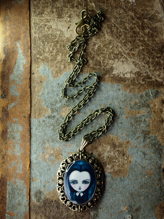 Wednesday Addams is featured in one of Danita's beautiful handmade jewelry necklaces