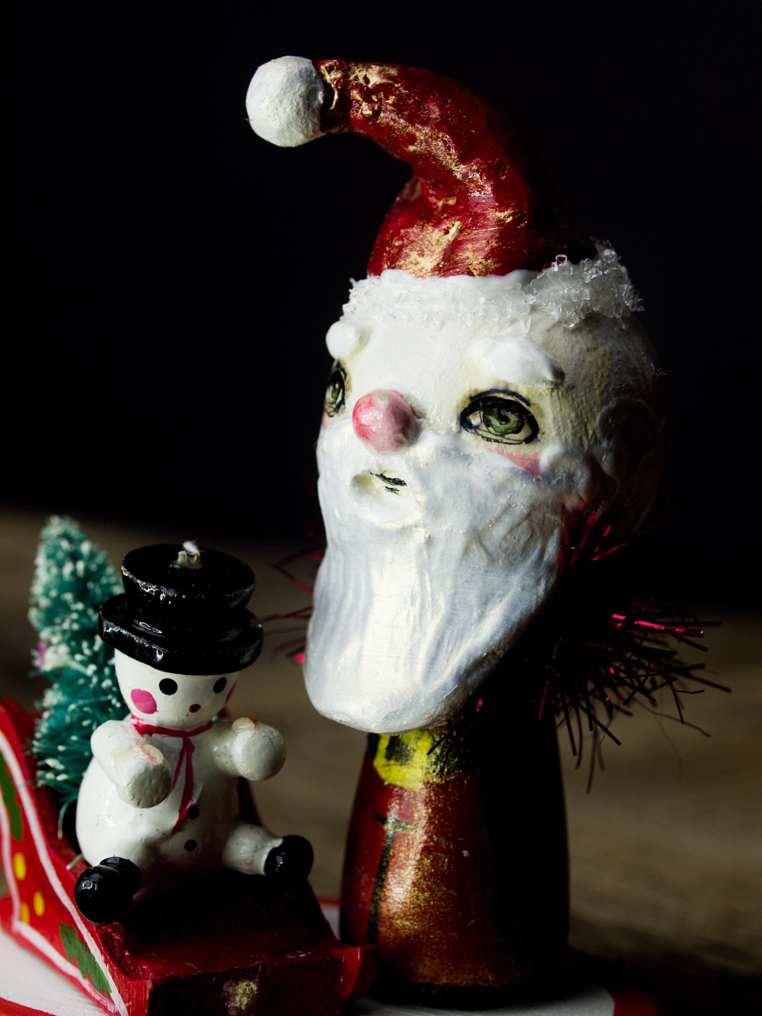 Santa in his magic sled, a holiday wood kokeshi art doll created by Danita Art
