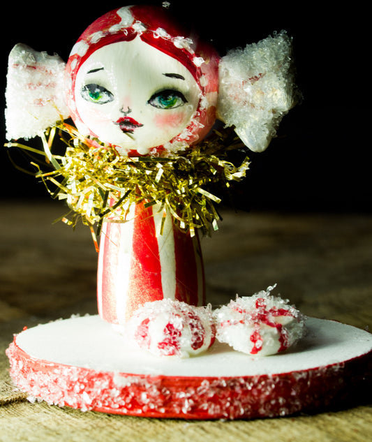 Peppermint candy girl, a holiday wood kokeshi art doll created by Danita Art