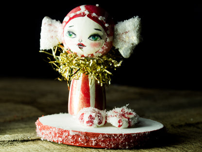 Peppermint candy girl, a holiday wood kokeshi art doll created by Danita Art