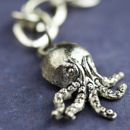 Octopus mermaid girl necklace by Danita. One of a kind jewelry with faceted glass beads.