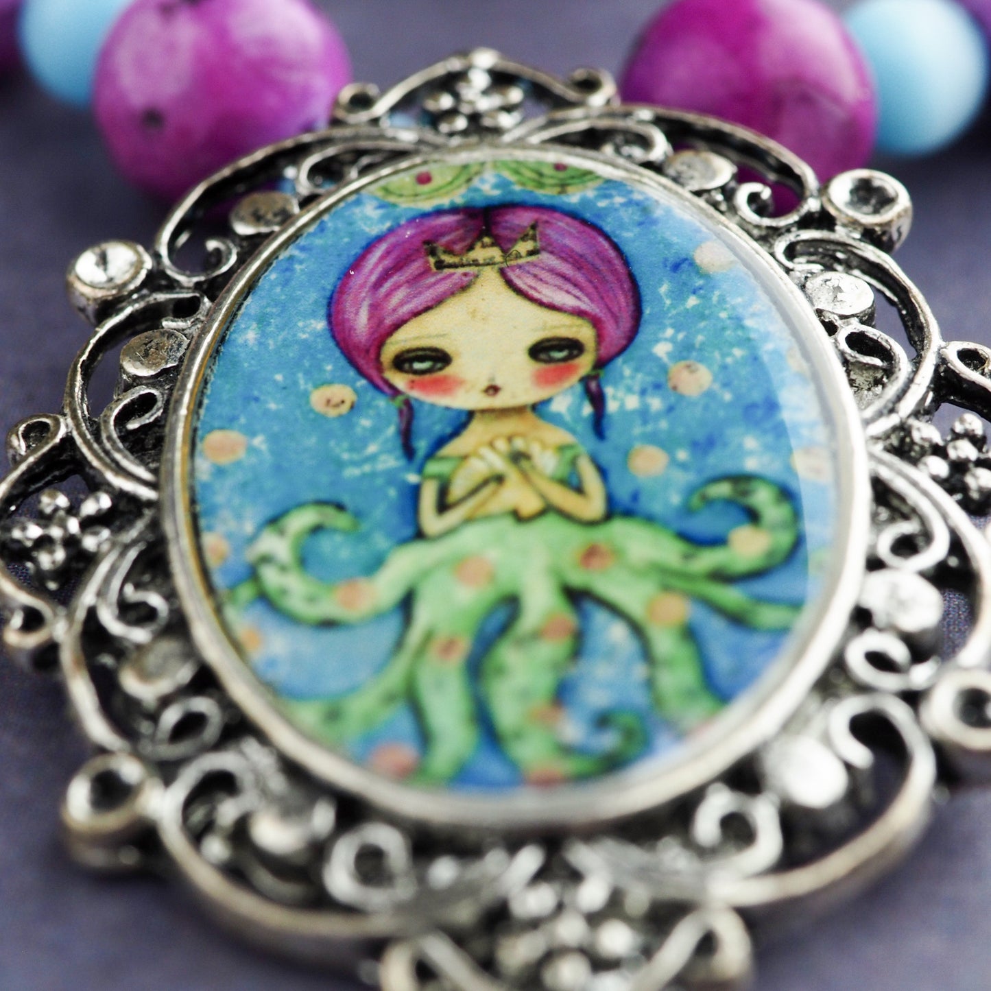 Octopus mermaid girl necklace by Danita. One of a kind jewelry with faceted glass beads.