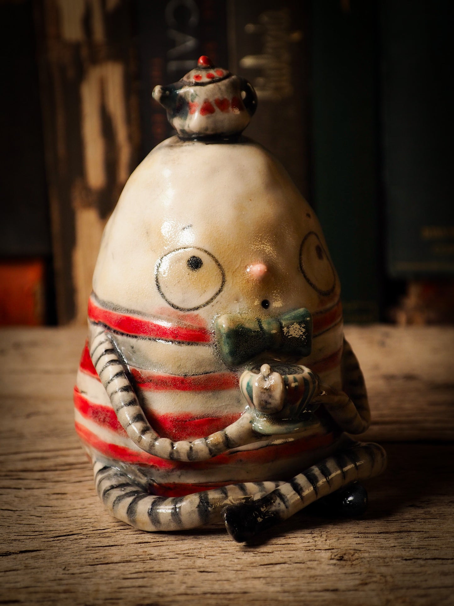 Humpty Dumpty vintage egg ceramic figure inspired by Alice in Wonderland made by Idania Salcido, the mixed media artist and ceramist behind Danita Art. Earth clay is hand sculpted and glazed and kiln fired to create a ceramic home decor heirloom figurine. Each unique art piece is a one of a kind fine pottery artwork.