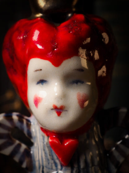 Red Queen hearts vintage ceramic figure inspired by Alice in Wonderland made by Idania Salcido, the mixed media artist and ceramist behind Danita Art. Earth clay is hand sculpted and glazed and kiln fired to create a ceramic home decor heirloom figurine. Each unique art piece is a one of a kind fine pottery artwork.
