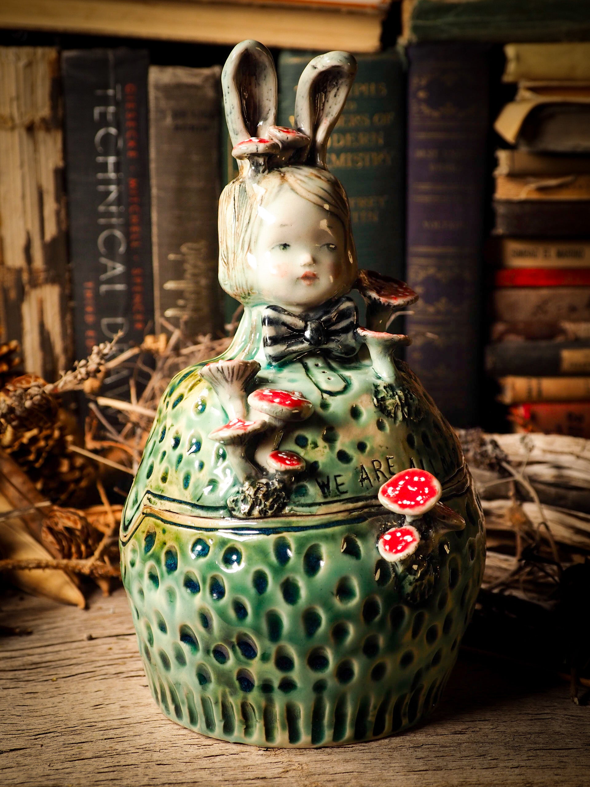 Alice the rabbit vintage ceramic figure inspired by Alice in Wonderland made by Idania Salcido, the mixed media artist and ceramist behind Danita Art. Earth clay is hand sculpted and glazed and kiln fired to create a ceramic home decor heirloom figurine. Each unique art piece is a one of a kind fine pottery artwork.