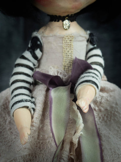 Danita fabricates the hands of her unique original soft art dolls using techniques that involve pouring liquid ceramic on vintage molds.