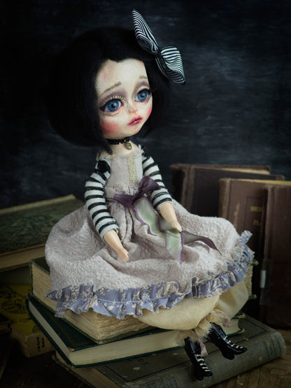 A Danita original and one of a kind hand made art doll. She is made with paper clay, glass eyes and handmade clothes.
