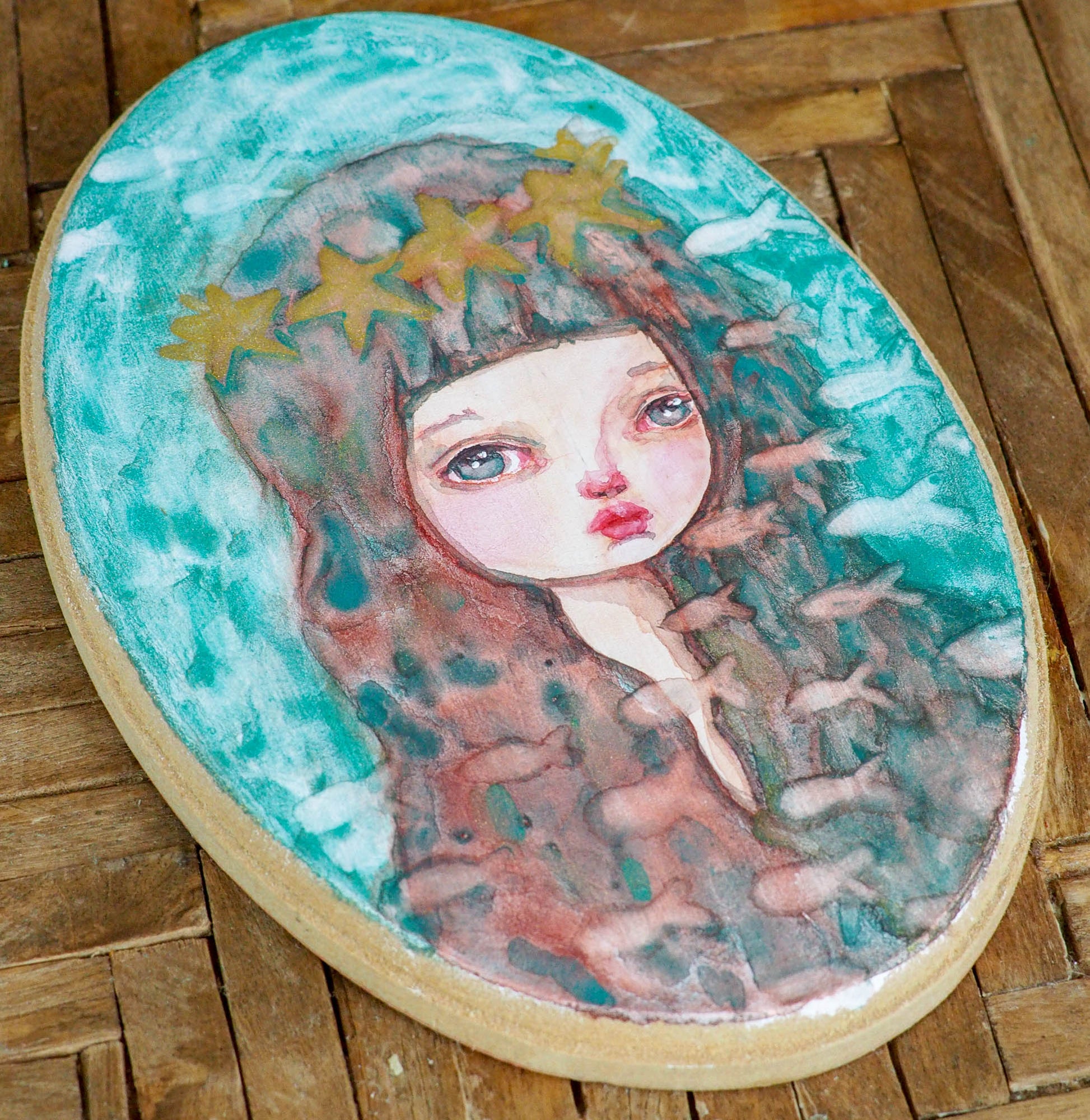 Mermaids are part of danita's painting repertoire, I love painting them! I am painting lots of watercolors now due my lack of space, but that has not stopped my creativity! I got a few oval wood panels and I have been using them to paint original watercolor paintings and illustration.