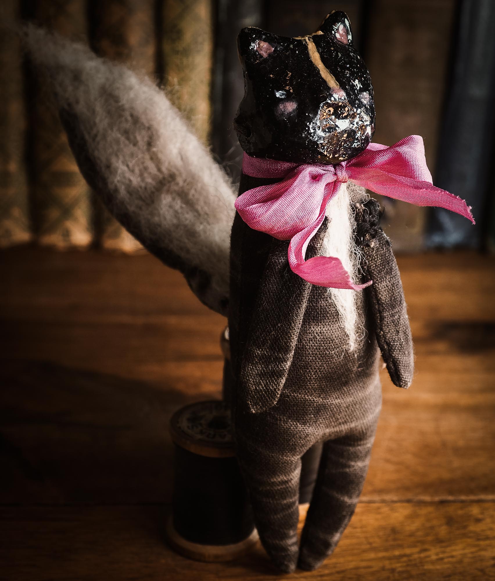 Skunk Toy Woodlands Soft sculpture art doll by Idania Salcido Danita Art with a Handmade ceramics face, organic dyed fabric and silk bow
