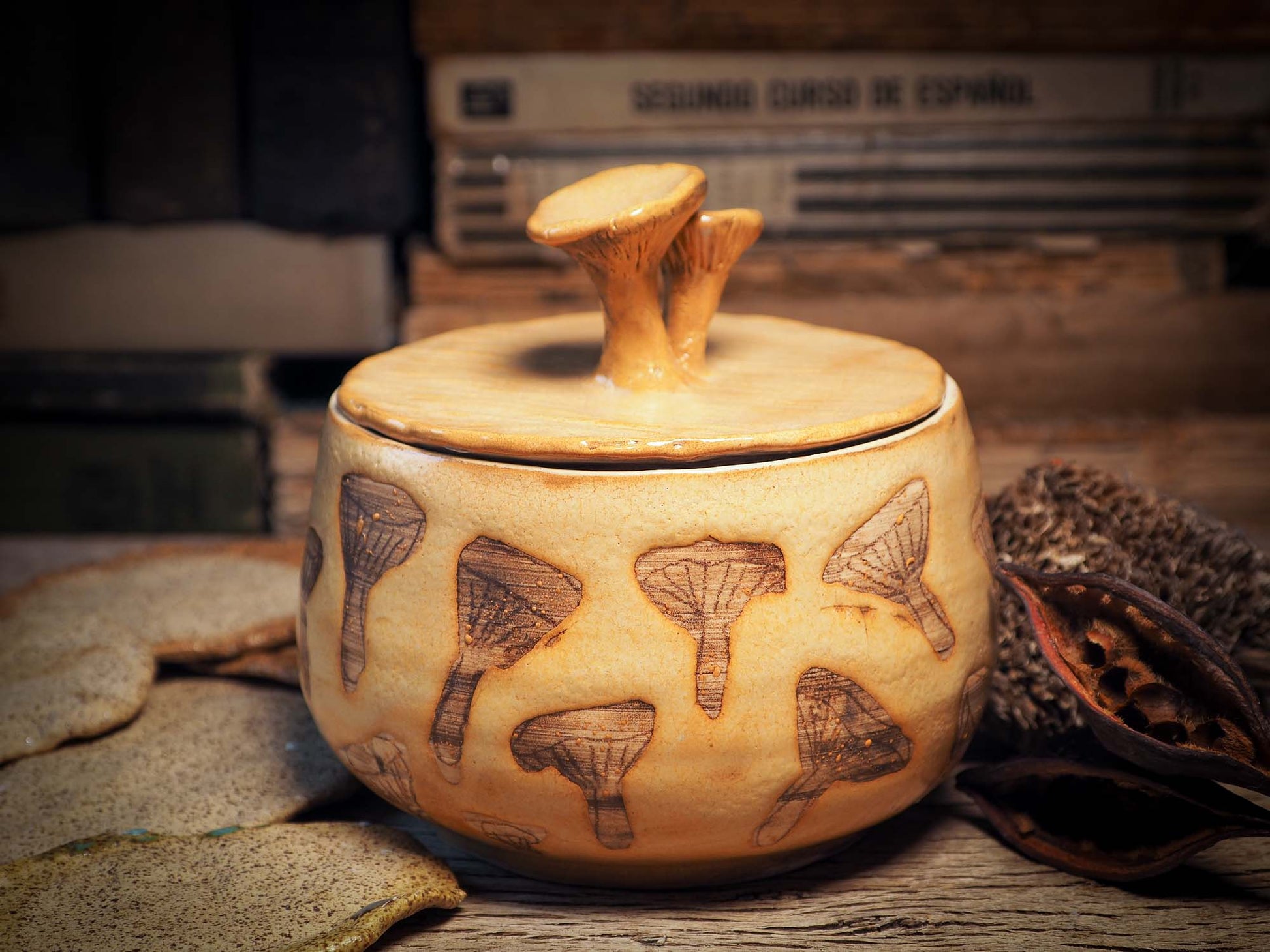 This handmade ceramic jar with lid was created by me, Idania Salcido, the artist behind Danita Art on my studio with lots of love. It features sgraffito mushrooms with beautiful warm color glaze and mushrooms on the lid. It will be perfect to keep everything you love safe and away from prying eyes.