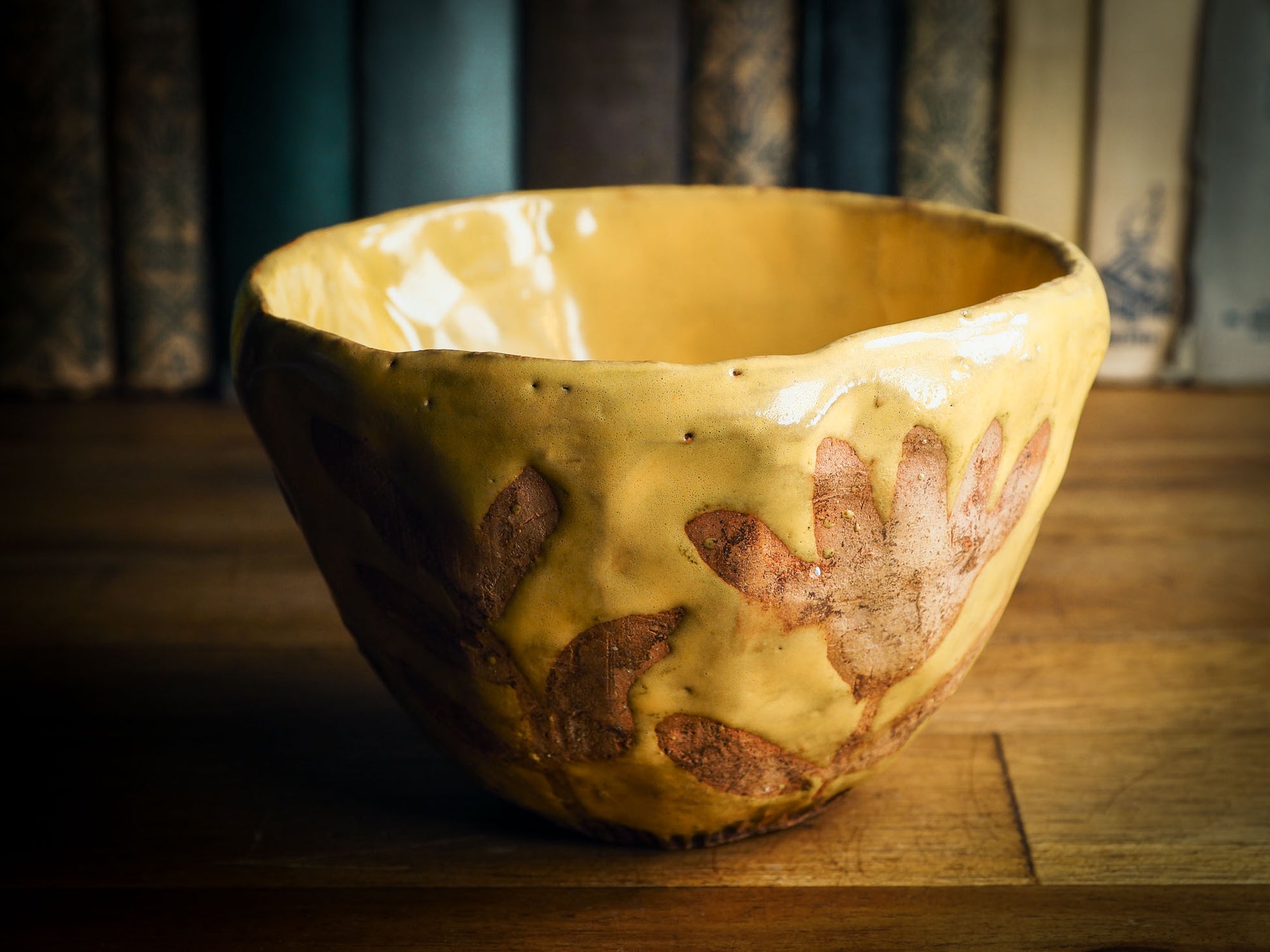 Original fired earthenware ceramic hand pinched bowl with yellow and brown flowers glazed and hand painted motif by Idania Salcido, the artist behind danita Art.