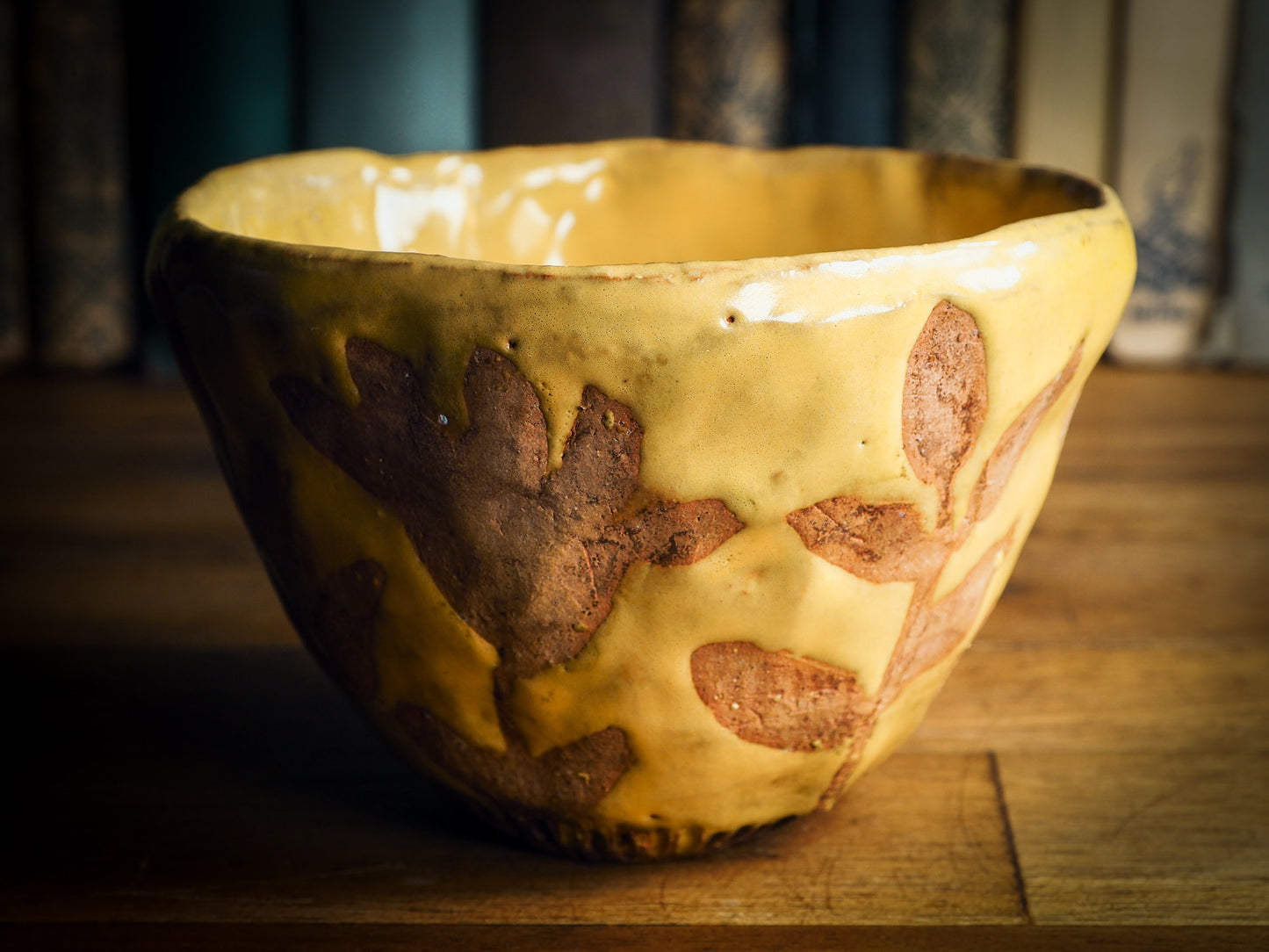 Original fired earthenware ceramic hand pinched bowl with yellow and brown flowers glazed and hand painted motif by Idania Salcido, the artist behind danita Art.