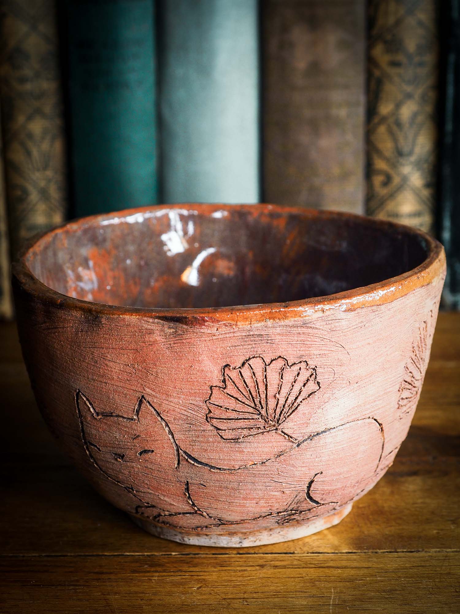 An original Idania Salcido Danita Art pinched ceramic cat pet food bowl. Handmade from locally foraged clay, this glazed ceramics one of a kind artwork is perfect for any kitchen plate and bowls unique collection. Thumbprints and  intentionally irregular shape give the bowl a cozy, warmly familiar feel when you pick it.