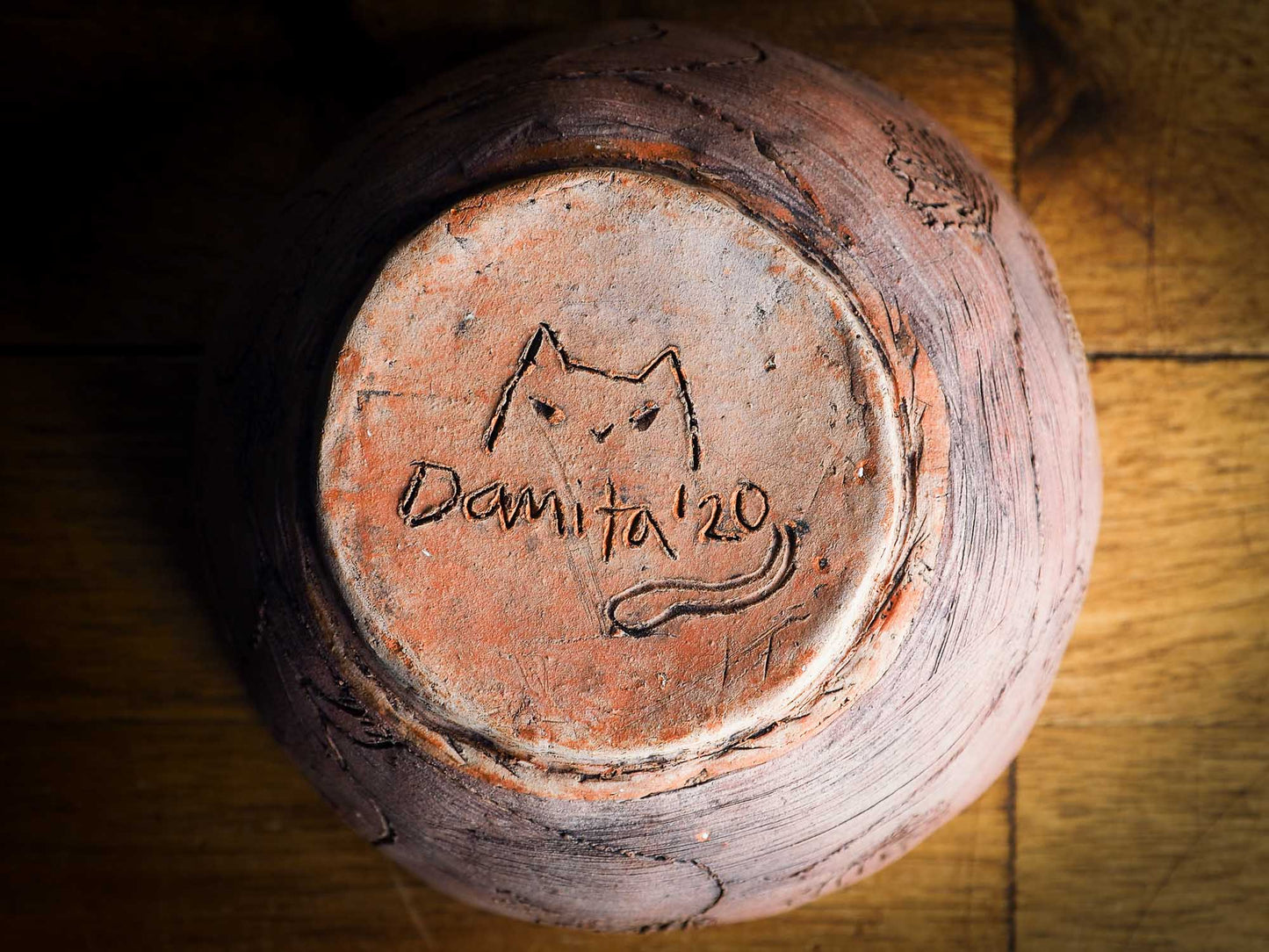 An original Idania Salcido Danita Art pinched ceramic cat pet food bowl. Handmade from locally foraged clay, this glazed ceramics one of a kind artwork is perfect for any kitchen plate and bowls unique collection. Thumbprints and  intentionally irregular shape give the bowl a cozy, warmly familiar feel when you pick it.