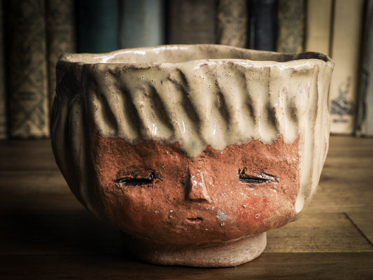 An original Idania Salcido Danita Art pinched ceramic cat pet food bowl. Handmade from locally foraged clay, this glazed ceramics one of a kind artwork is perfect for any kitchen plate and bowls unique collection. Thumbprints and  intentionally irregular shape give the bowl a cozy, warmly familiar feel when you pick it. This bowl has one of Danita'sa famous painting and doll faces on it. Perfect for your home!