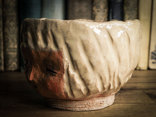 An original Idania Salcido Danita Art pinched ceramic cat pet food bowl. Handmade from locally foraged clay, this glazed ceramics one of a kind artwork is perfect for any kitchen plate and bowls unique collection. Thumbprints and  intentionally irregular shape give the bowl a cozy, warmly familiar feel when you pick it. An adorable face like the ones Danita paints and makes dolls with is featured!