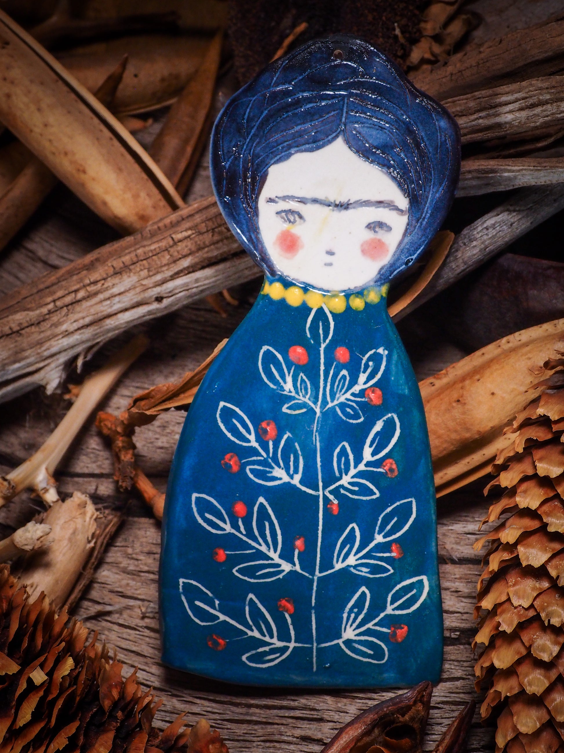 An original Christmas Holiday tree glazed ceramic ornament handmade by Idania Salcido, the artist behind Danita Art. Glazed carved sgraffito stoneware, hand painted and decorated, it is illustrated by hand with Frida Kahlo, Mexican motifs and bold, bright and colorful ceramic glazes.