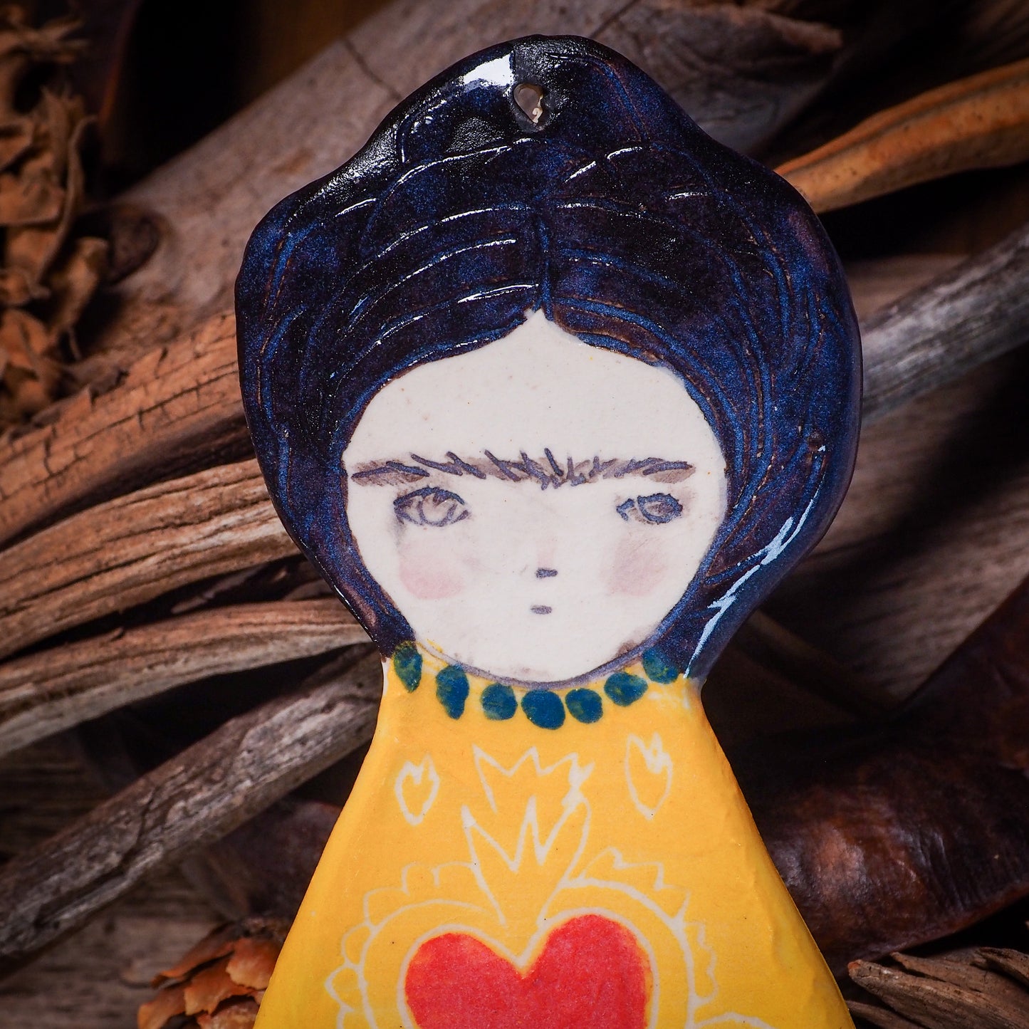 An original Christmas Holiday tree glazed ceramic ornament handmade by Idania Salcido, the artist behind Danita Art. Glazed carved sgraffito stoneware, hand painted and decorated, it is illustrated by hand with Frida Kahlo, Mexican motifs and bold, bright and colorful ceramic glazes.