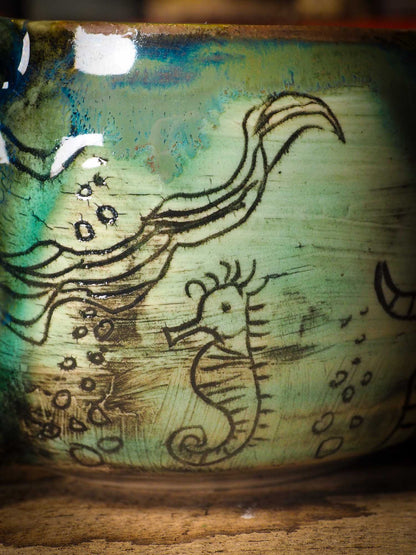 This is a handmade ceramic coffee or tea mug, create entirely by Idania Salcido, the artist behind Danita Art. The mermaid swimming on this mug is hand painted before glazing it and firing it on my very own kiln. It will be perfect for driving your favorite coffee or tea, in company of a beautiful mermaid.
