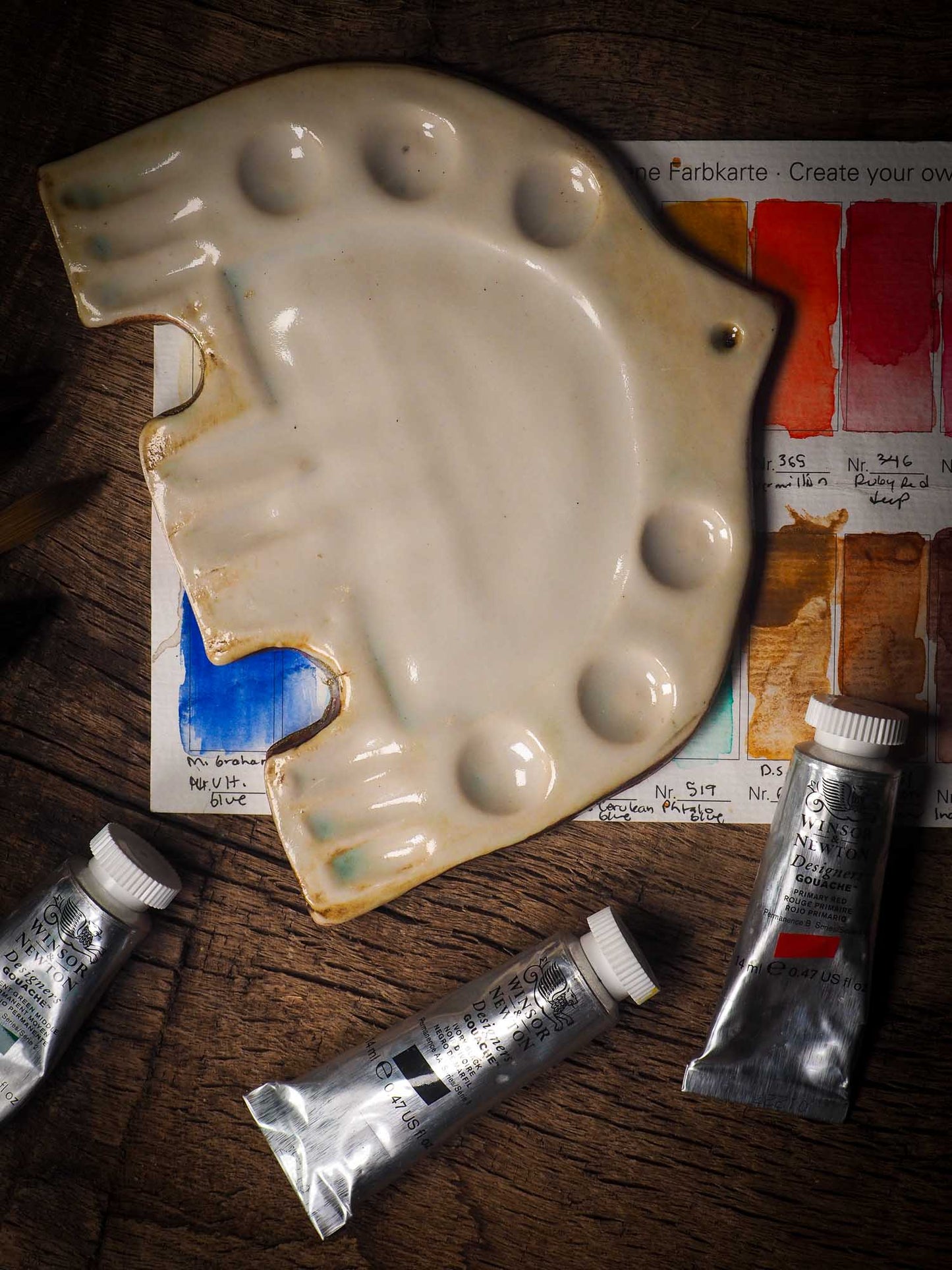 Each artist paint glazed ceramic palette by Idania Salcido, the artist behind Danita Art, is hand sculpted and fired with paint and scratch resistant glazes and with enough paint wells to keep and mix colors at ease. Acrylics, Oils and watercolors can be used, it is perfect for any medium! Clean with water or mineral spirits.
