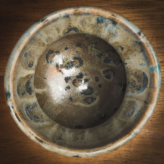 An original Idania Salcido Danita Art pinched ceramic cat pet food plate. Handmade from stoneware, this glazed ceramics one of a kind artwork is perfect for any kitchen plate and bowls unique collection. Thumbprints and  intentionally irregular shape give the bowl a cozy, warmly familiar feel when you pick it. A cute little black cat and a home is painted in underglaze.