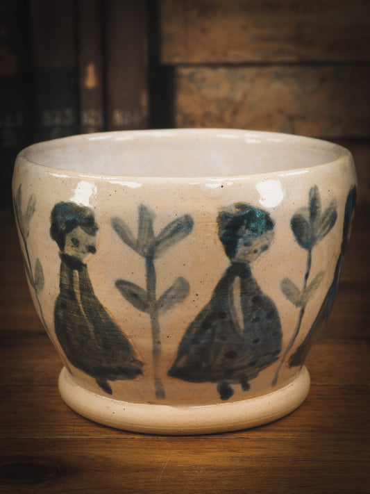 An original Idania Salcido Danita Art pinched ceramic cat pet food plate. Handmade from stoneware, this glazed ceramics one of a kind artwork is perfect for any kitchen plate and bowls unique collection. Thumbprints and  intentionally irregular shape give the bowl a cozy, warmly familiar feel when you pick it. Flowers and girls painted in underglaze make this a beautiful unique piece.