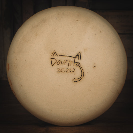 An original Idania Salcido Danita Art pinched ceramic cat pet food plate. Handmade from stoneware, this glazed ceramics one of a kind artwork is perfect for any kitchen plate and bowls unique collection. Thumbprints and  intentionally irregular shape give the bowl a cozy, warmly familiar feel when you pick it. A cute little cat hiding in flowers is carved on the sides.