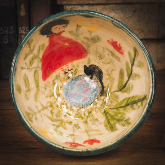 An original Idania Salcido Danita Art pinched ceramic cat pet food plate. Handmade from stoneware, this glazed ceramics one of a kind artwork is perfect for any kitchen plate and bowls unique collection. Thumbprints and  intentionally irregular shape give the bowl a cozy, warmly familiar feel when you pick it. A beautiful cute cat is playing with his girl friend on an underglaze watercolor pond.