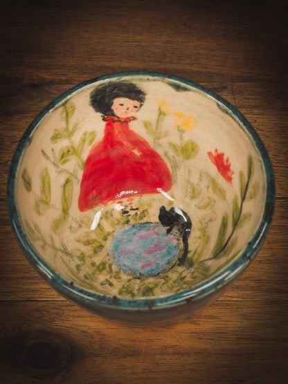 An original Idania Salcido Danita Art pinched ceramic cat pet food plate. Handmade from stoneware, this glazed ceramics one of a kind artwork is perfect for any kitchen plate and bowls unique collection. Thumbprints and  intentionally irregular shape give the bowl a cozy, warmly familiar feel when you pick it. A beautiful cute cat is playing with his girl friend on an underglaze watercolor pond.