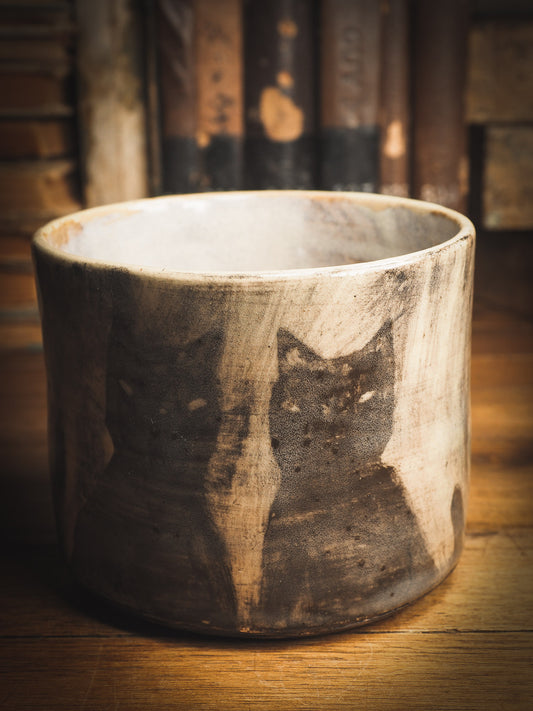 An original Idania Salcido Danita Art ceramic cat pet food plate. Handmade from stoneware, this glazed ceramics one of a kind artwork is perfect for any kitchen plate and bowls unique collection. Thumbprints and  intentionally irregular shape give the bowl a cozy, warmly familiar feel when you pick it. Black cats guard your favorite drink. They are perfect to guard evil spirits at night too!