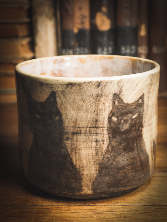 An original Idania Salcido Danita Art ceramic cat pet food plate. Handmade from stoneware, this glazed ceramics one of a kind artwork is perfect for any kitchen plate and bowls unique collection. Thumbprints and  intentionally irregular shape give the bowl a cozy, warmly familiar feel when you pick it. Black cats guard your favorite drink. They are perfect to guard evil spirits at night too!