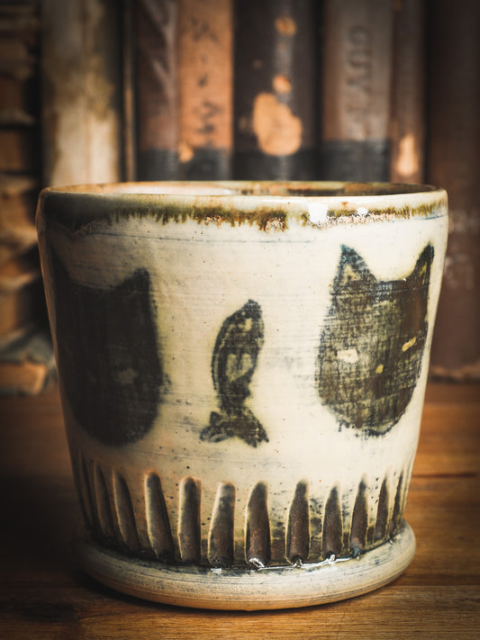 An original Idania Salcido Danita Art ceramic cat pet food plate. Handmade from stoneware, this glazed ceramics one of a kind artwork is perfect for any kitchen plate and bowls unique collection. Thumbprints and  intentionally irregular shape give the bowl a cozy, warmly familiar feel when you pick it. Black cats guard your favorite drink. They are perfect to guard evil spirits at night too!