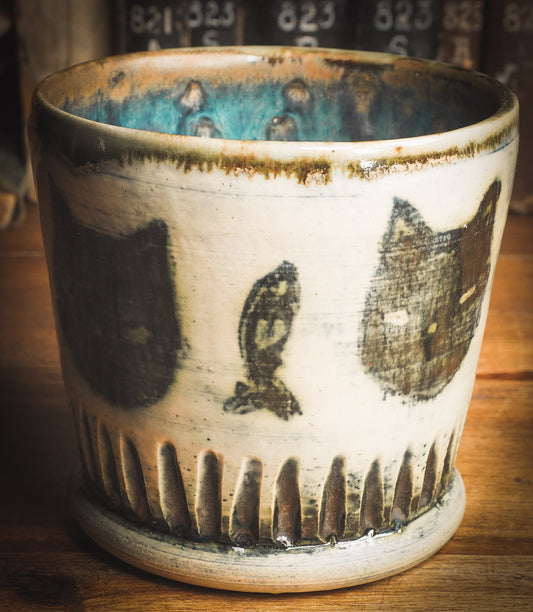 An original Idania Salcido Danita Art ceramic cat pet food plate. Handmade from stoneware, this glazed ceramics one of a kind artwork is perfect for any kitchen plate and bowls unique collection. Thumbprints and  intentionally irregular shape give the bowl a cozy, warmly familiar feel when you pick it. Black cats guard your favorite drink. They are perfect to guard evil spirits at night too!