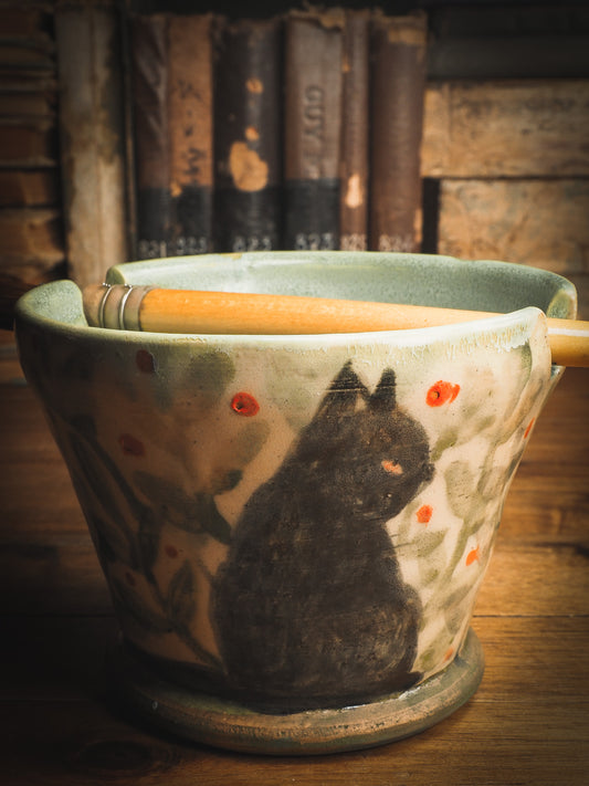 An original Idania Salcido Danita Art ceramic cat pet food plate. Handmade from stoneware, this glazed ceramics one of a kind artwork is perfect for any kitchen plate and bowls unique collection. Thumbprints and  intentionally irregular shape give the bowl a cozy, warmly familiar feel when you pick it. This is the painter's cat. Like my black cat Loki, he loves to hang around with me in the studio. He's great at holding your brushes and paint water for you.