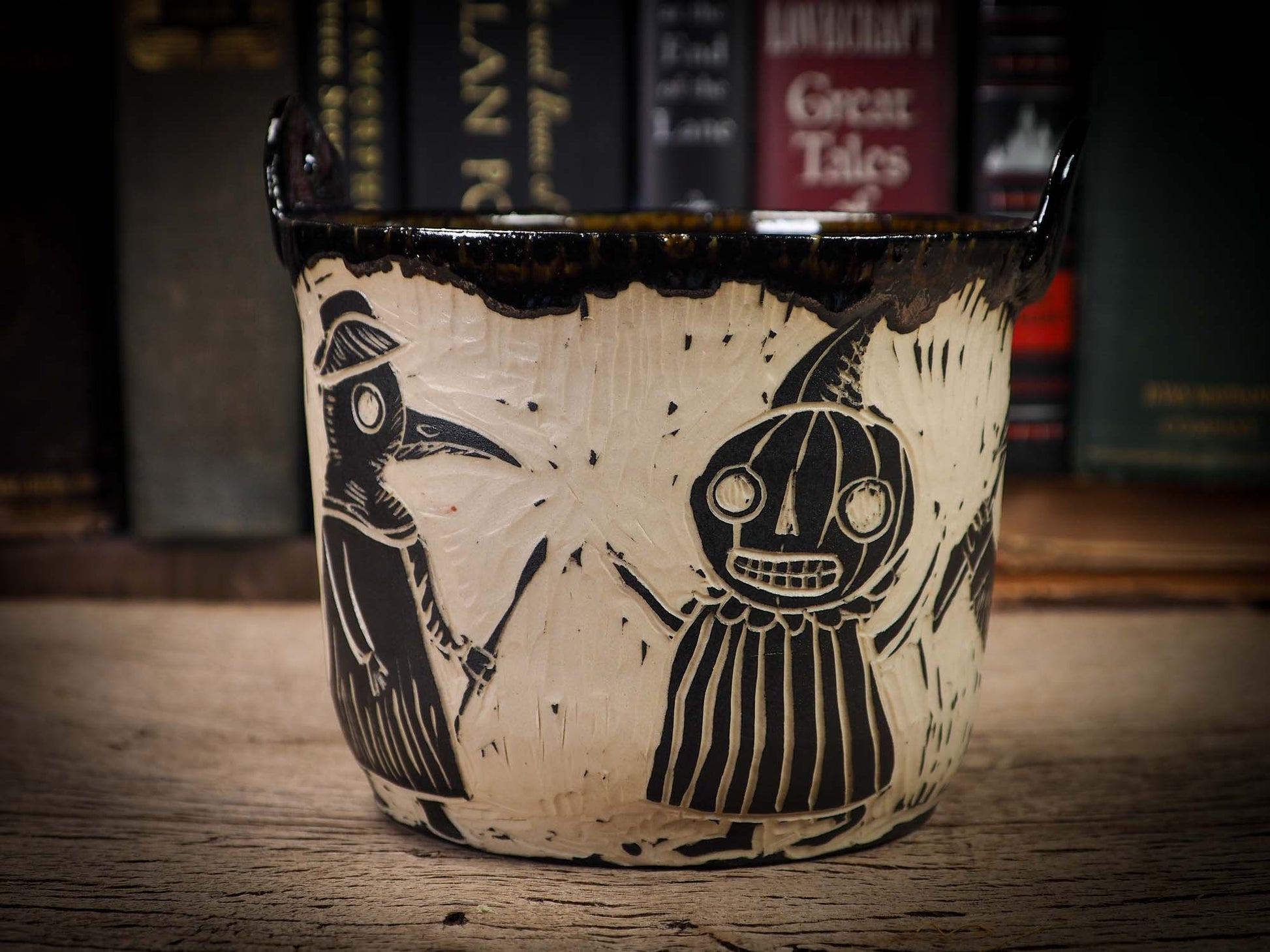 An original Halloween ceramic bowl by Idania Salcido, the artist behind Danita Art. Made with wheel thrown clay, hand carved and glazed by the artist. The carved witches, ghosts, goblins, plague doctors and vampires give it a nice, folk art primitive feel to it. Perfect for Halloween Candy, ice cream and fruit and as pet cat bowl.