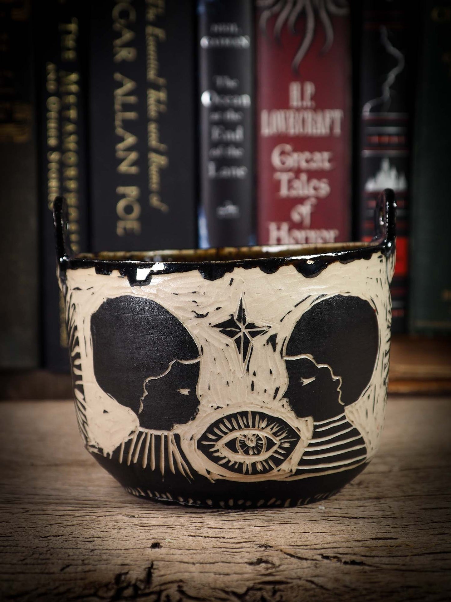 An original Halloween ceramic bowl by Idania Salcido, the artist behind Danita Art. Made with wheel thrown clay, hand carved and glazed by the artist. The carved witches, ghosts, goblins and vampires give it a nice, folk art primitive feel to it. Perfect for Halloween Candy, ice cream and fruit and as pet cat bowl.