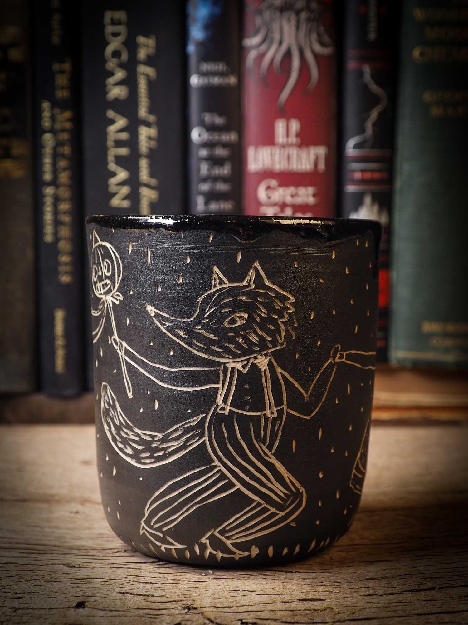 An original Halloween ceramic bowl by Idania Salcido, the artist behind Danita Art. Made with wheel thrown clay, hand carved and glazed by the artist. The carved witches, ghosts, goblins and vampires give it a nice, folk art primitive feel to it. Perfect for Halloween Candy, ice cream and fruit and as pet cat bowl.