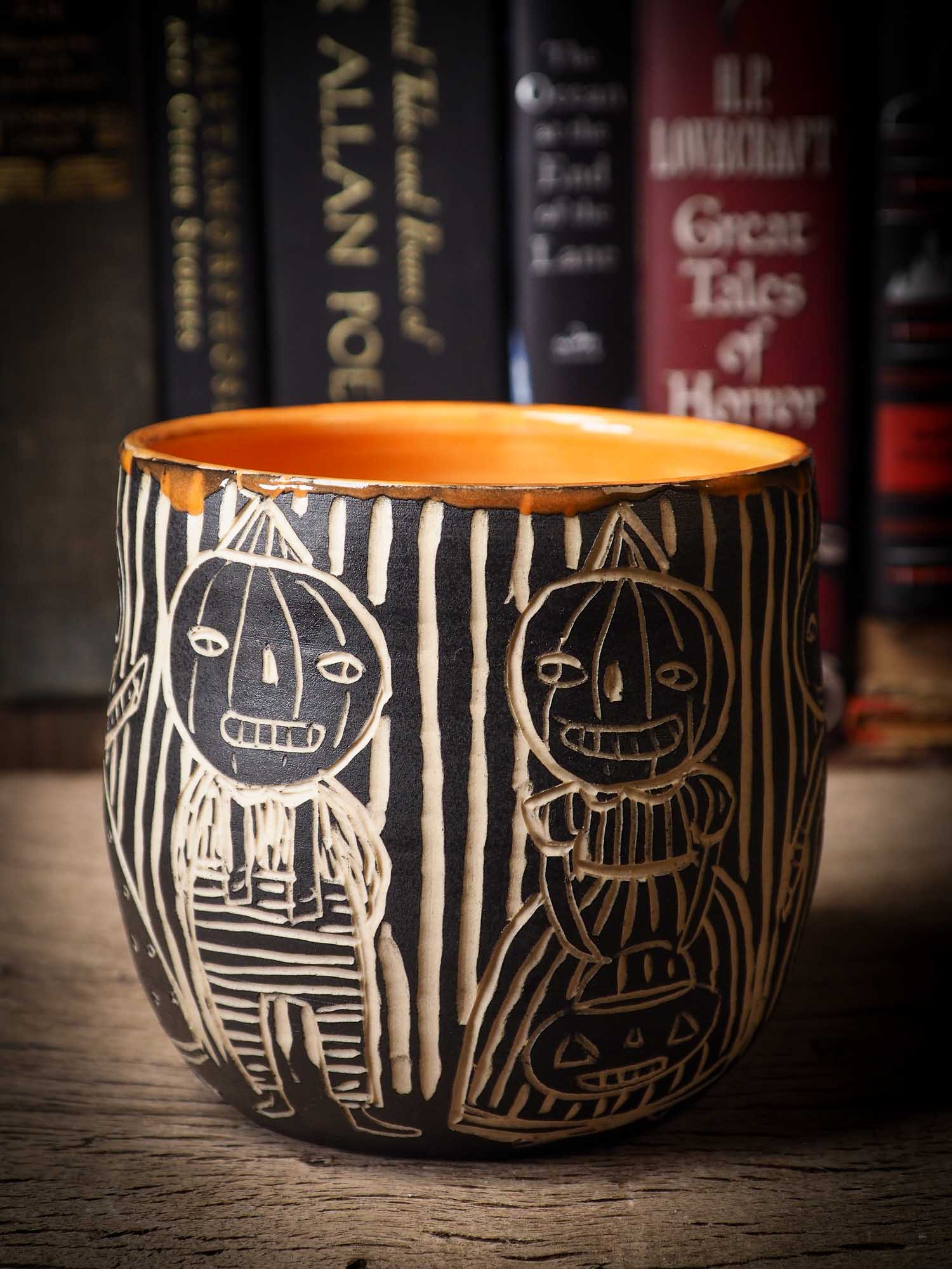 An original Halloween ceramic bowl bucket pail handmade by Idania Salcido the artist behind Danita Art. Made with wheel thrown clay hand carved and glazed by the artist. Witches, ghosts, goblins, black cats, vampires give a folk art primitive feel to it. Perfect for Halloween Candy, ice cream and fruit, a pet cat bowl.