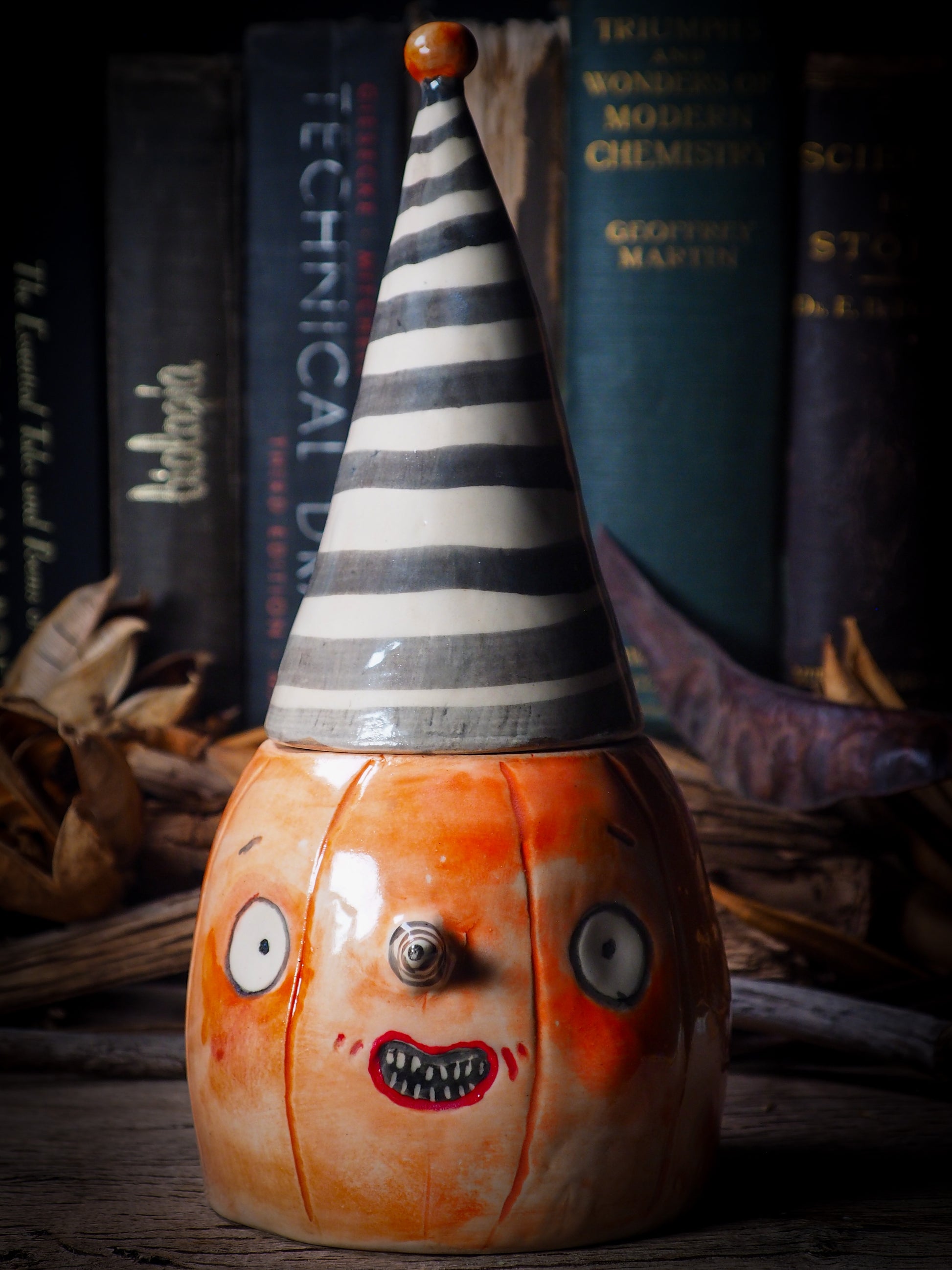 Fire glazed ceramic figurine by Idania Salcido, Danita Art. On Halloween, Danita creates spooky cute hand made ceramic figures to decorate your home in the scariest holiday of the year. Ghosts, witches, ghouls, vampires, black cats, pumpkins, jack-o-lantern and creatures of the night in glazed ceramic home decor.