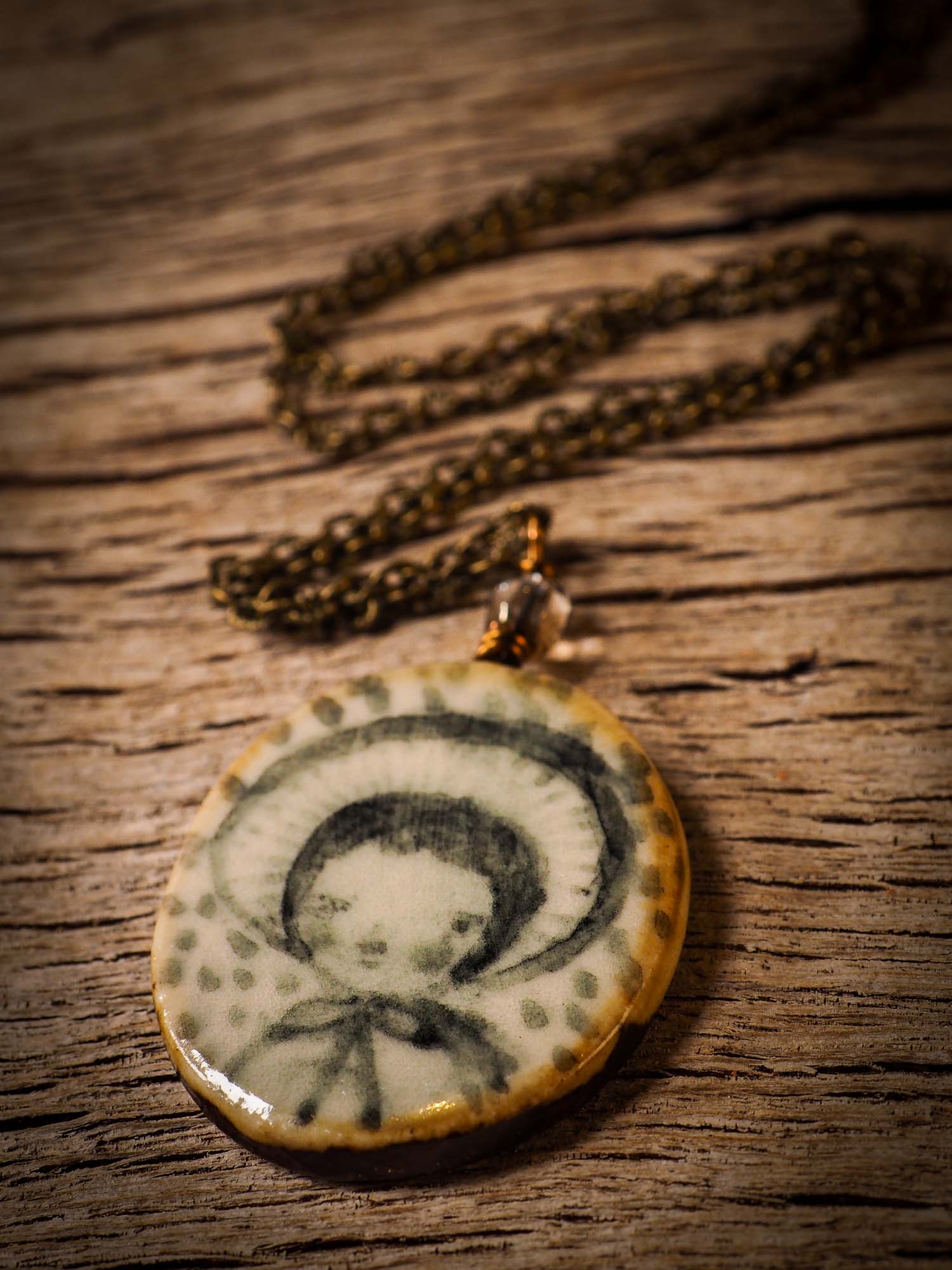 Unique fired ceramic porcelain necklace oval pendant by Idania Salcido, the artist behind Danita Art. Each jewelry setting is hand drawn and illustrated by the artist in her art studio, perfect for any dressing style. A casual gathering with friends or a fancy formal dinner, this necklace is a perfect fashion accessory