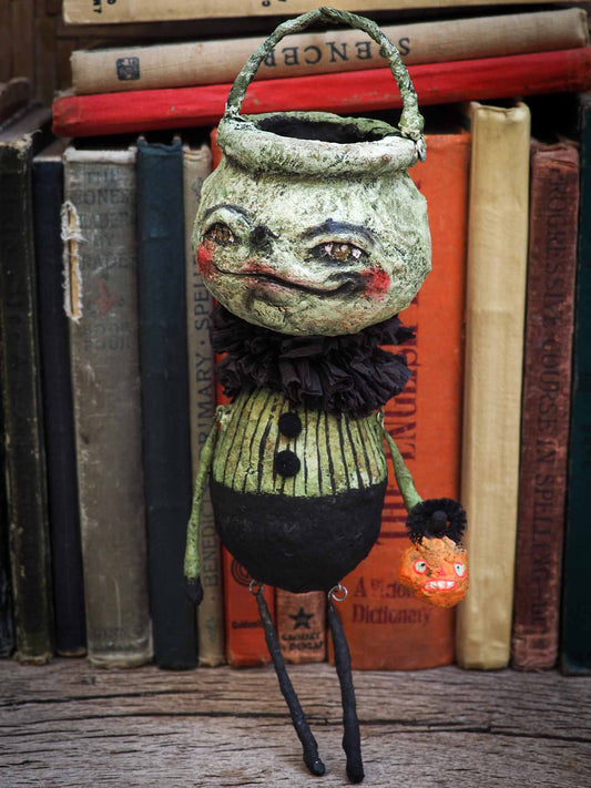 Handmade Halloween ornament posable doll by Danita. It is handmade using spun cotton and paper clay to make a whimsical Halloween home decor decoration
